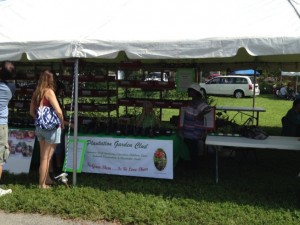 View of the people, tents and tomatoes for this event. 