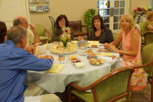 Marsha Eisenberg and guests enjoy the tea and treats that were served.